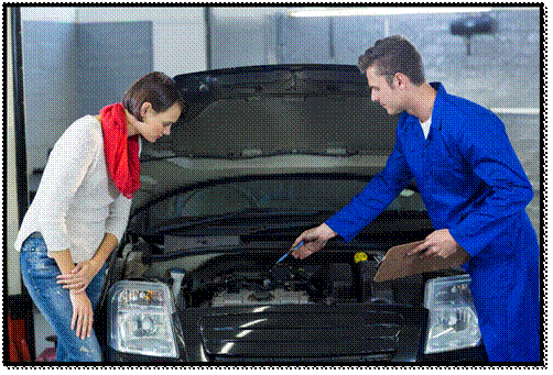 A man and woman inspecting a car engine together.