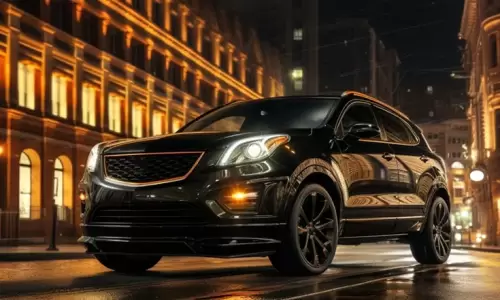 A black luxury SUV parked on a wet city street at night.